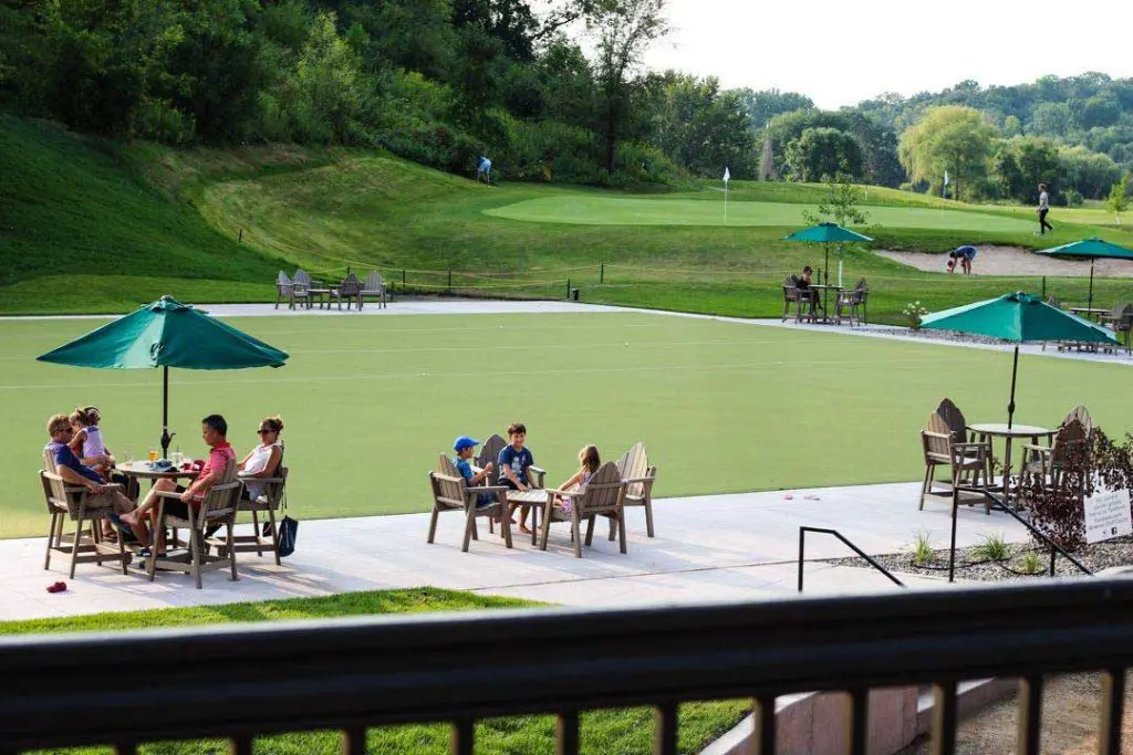 Patrons sitting at tables in courtyard