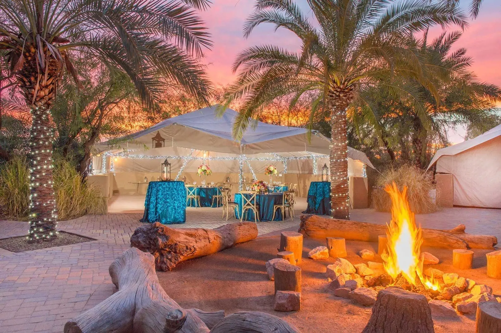 Cocktail tables with fire pit in foreground