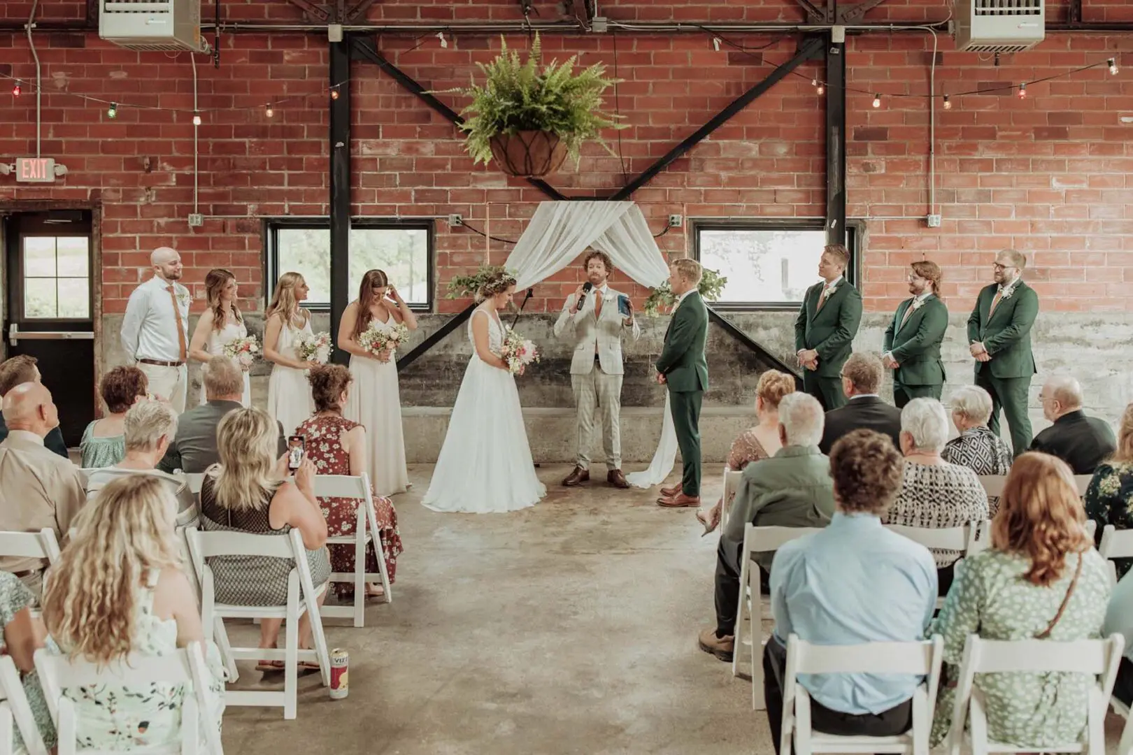 Wedding party standing at alter within City House