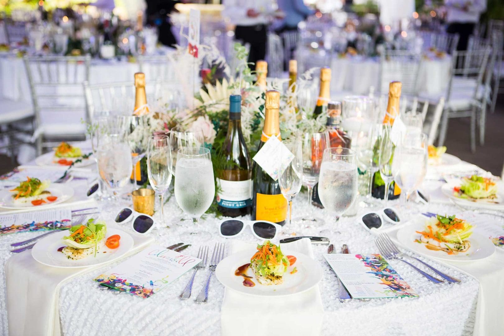 Close up of table setting with wine and champagne