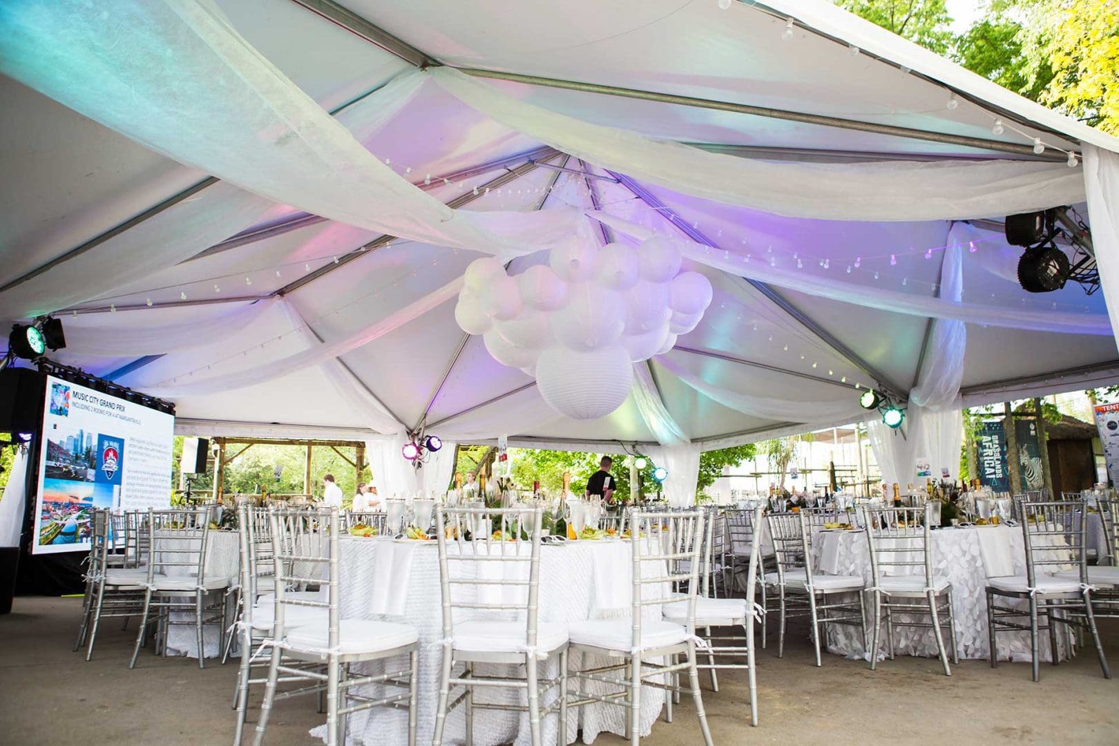 Outdoor table setting under tent for event