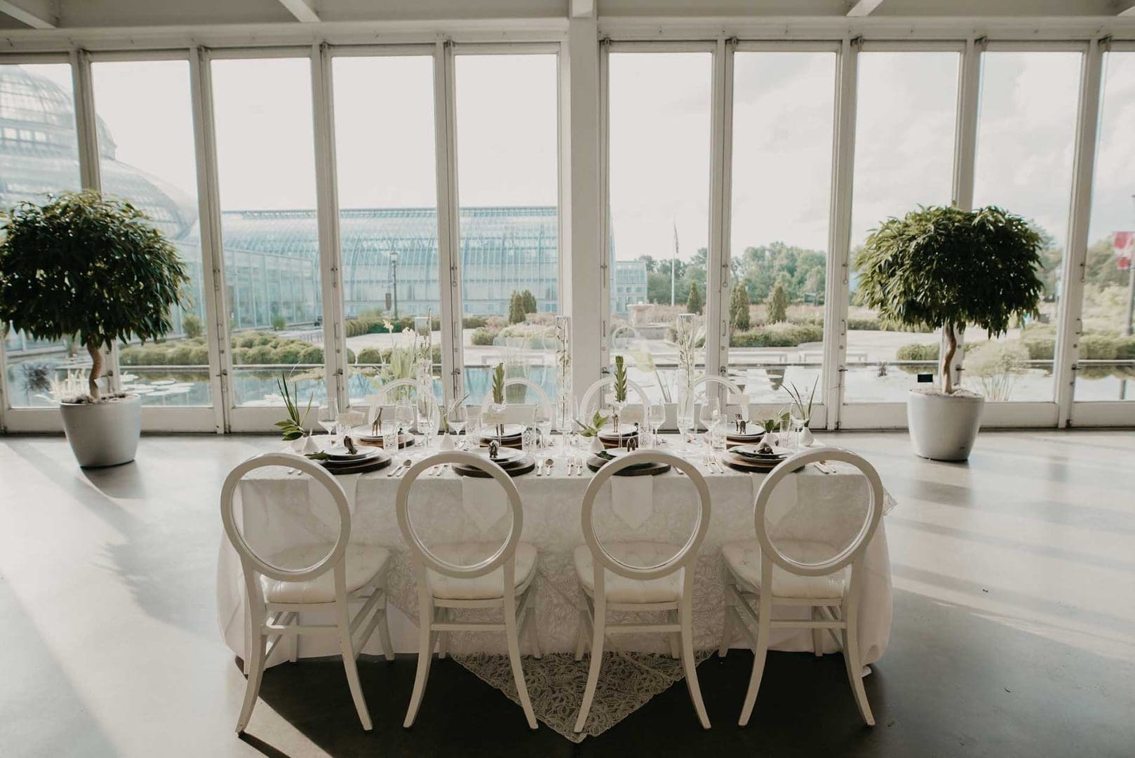 Grooms table overlooking windows of conservatory